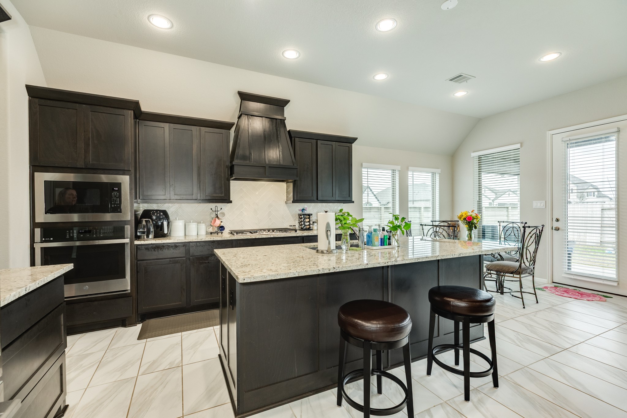 5138 Walnut Grv Lane Manvel, TX 77578 - Photo 14 of 43 a kitchen with counter top space cabinets and appliances
