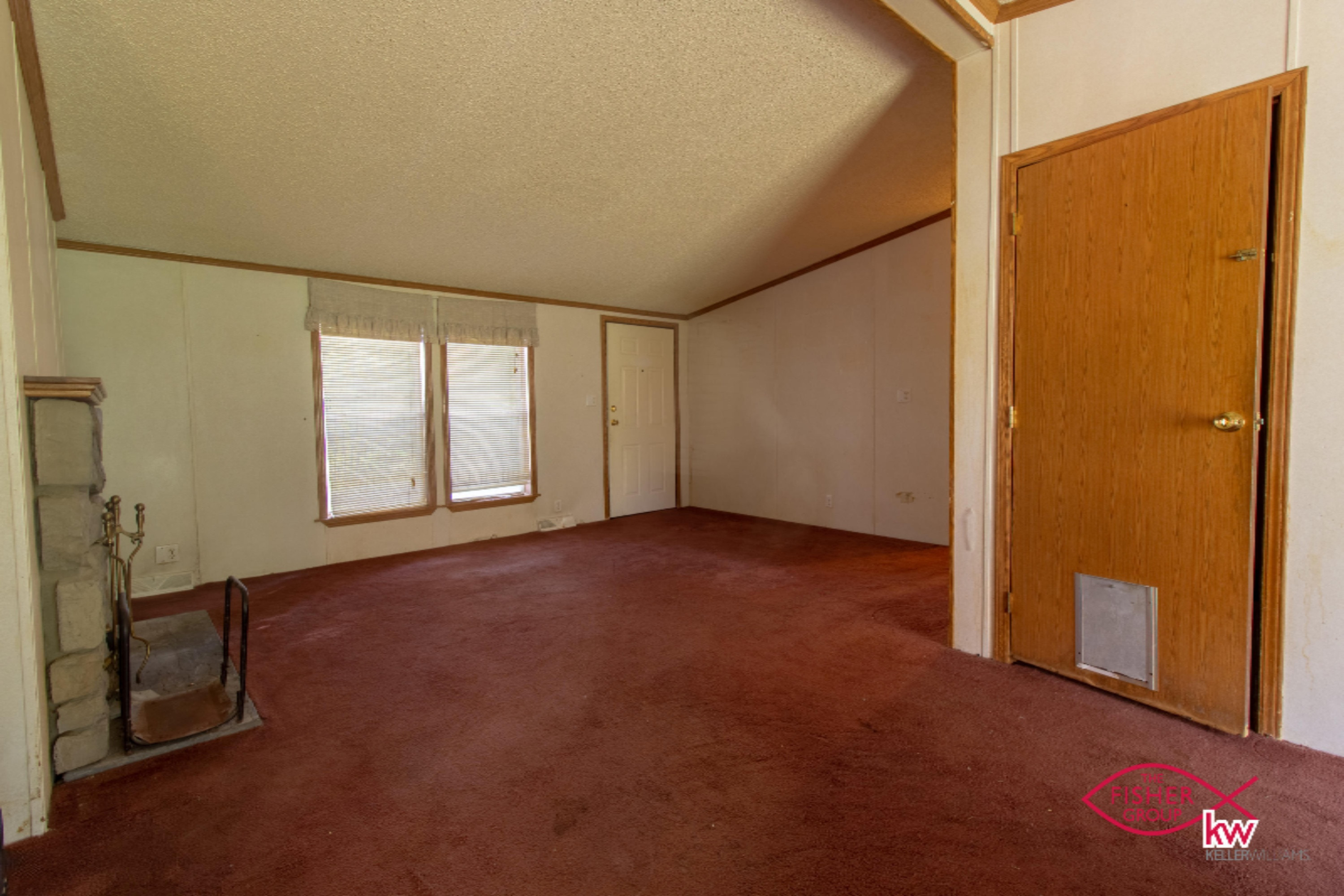 9104 Peck Lake Road Lowell, MI 49331 - Photo 3 of 31 Living room & side view of fireplace
