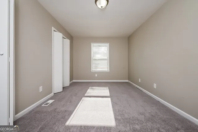 an empty room with windows