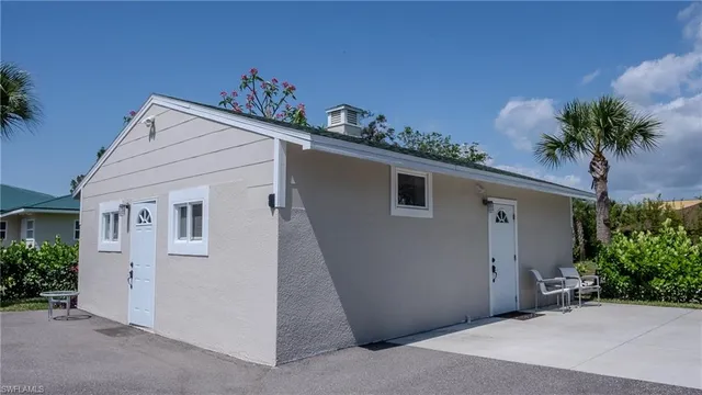 a view of a house with a potted plant and a window