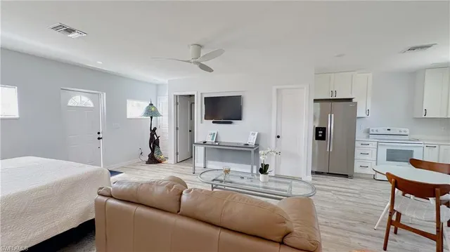 a room with a walk in closet and wooden floor