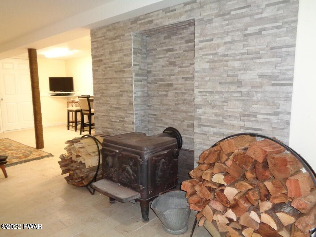 137 Rowland Road Greeley, PA 18425 - Photo 14 of 23 Cast iron wood buring fireplace