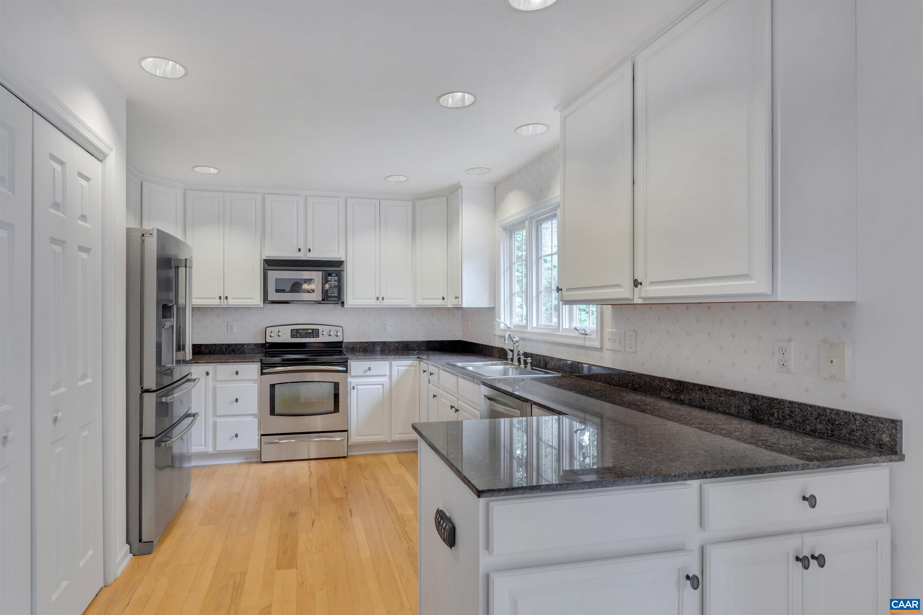11 Laguna Road Palmyra, VA 22963 - Photo 8 of 29 a kitchen with granite countertop a stove a sink and a refrigerator
