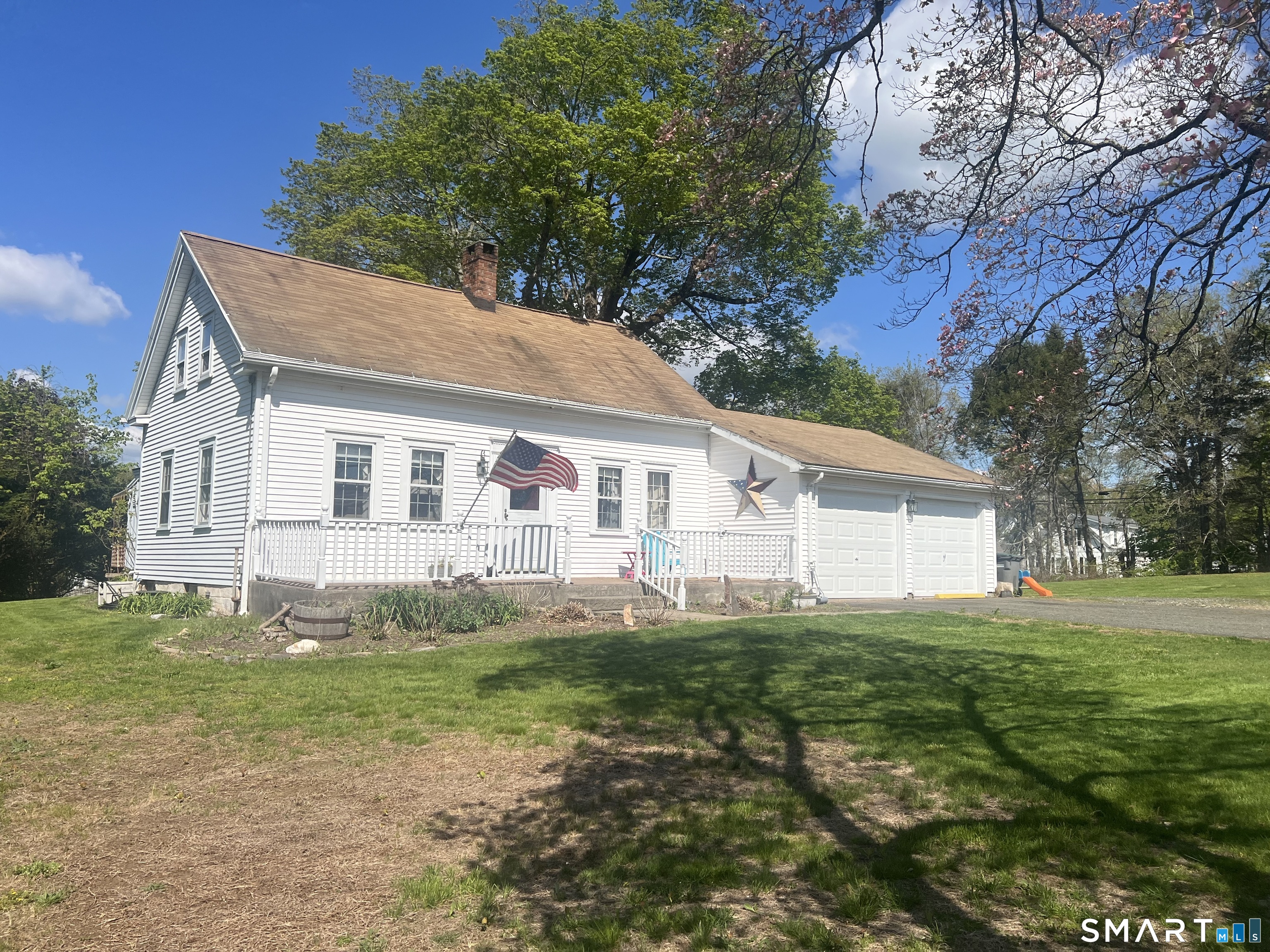 527 Lake Street Manchester, CT 06042 - Photo 2 of 15 a front view of a house with a yard and garage