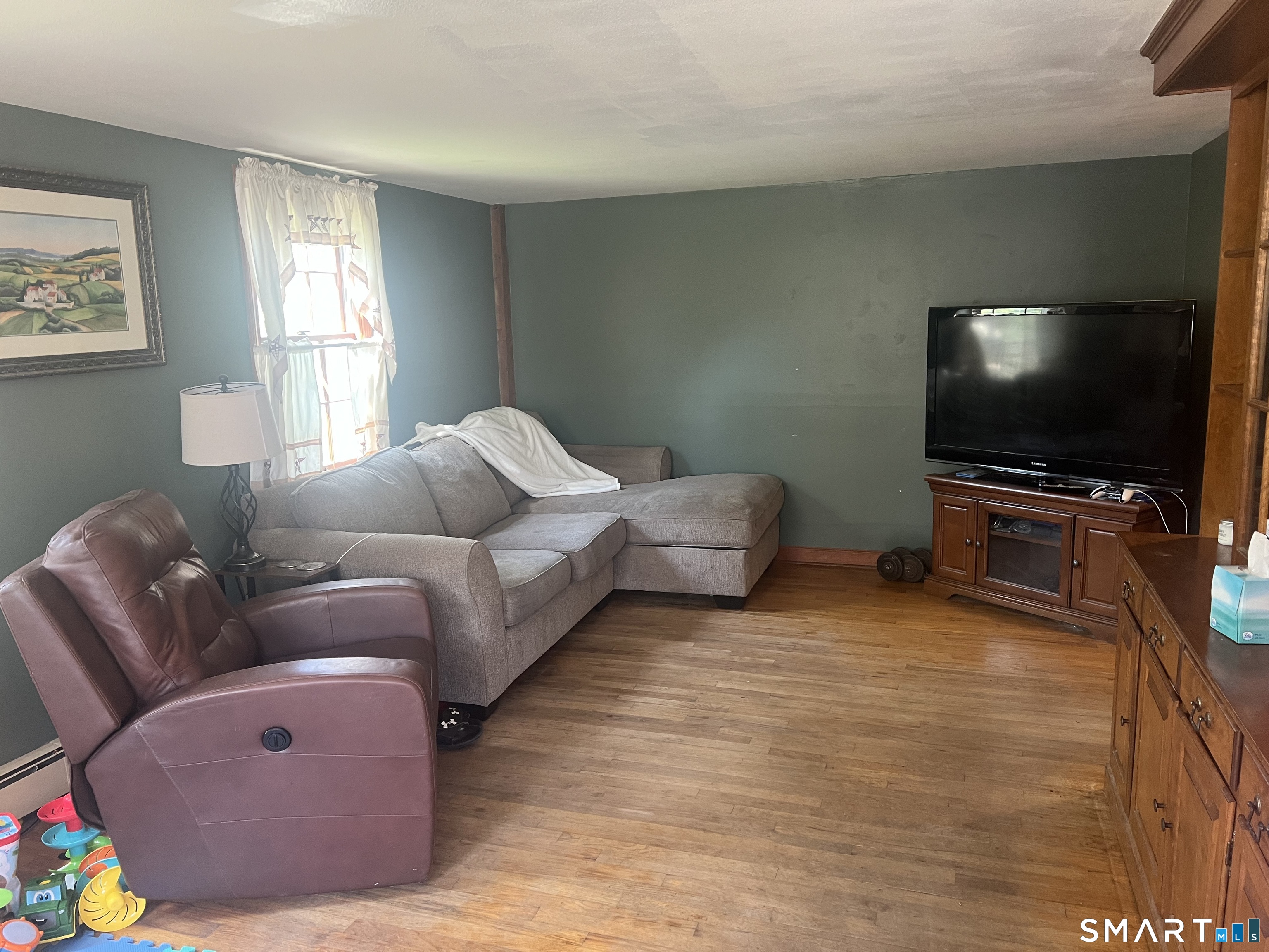 527 Lake Street Manchester, CT 06042 - Photo 9 of 15 a living room with furniture and a flat screen tv