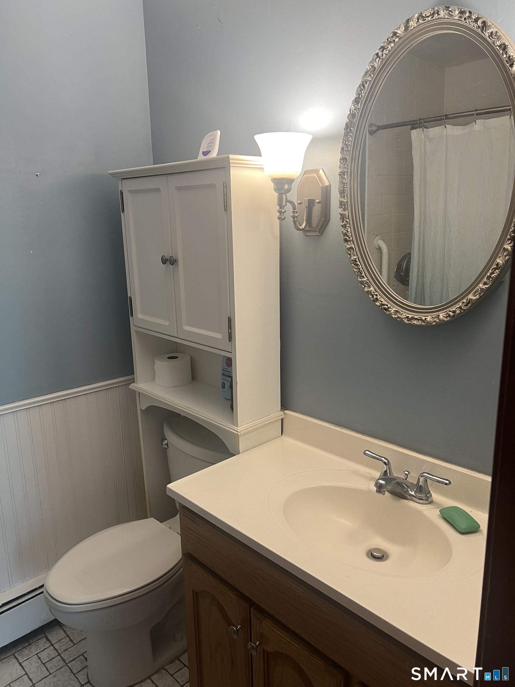527 Lake Street Manchester, CT 06042 - Photo 10 of 15 a bathroom with a sink a toilet and a mirror