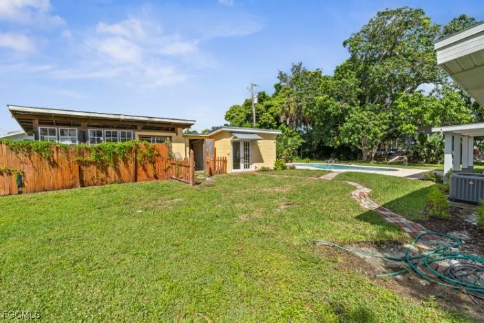 4970 Riverside Drive Estero, FL 33928 - Photo 14 of 35 a view of a house with backyard and a sitting area