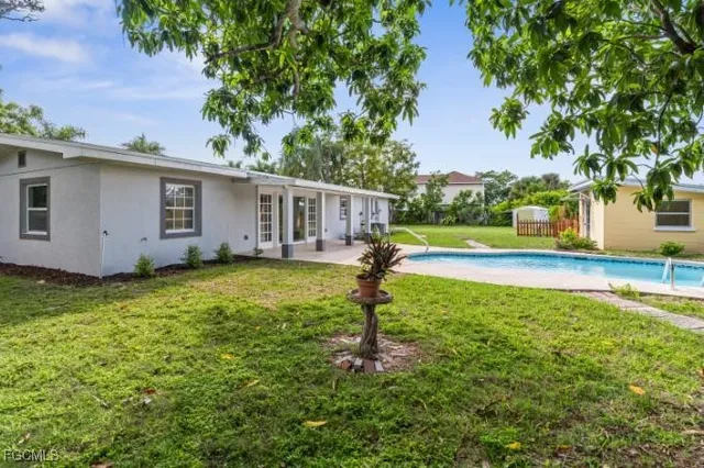 a kitchen with stainless steel appliances a refrigerator sink and microwave
