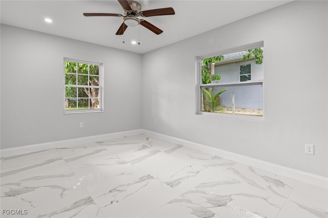 4970 Riverside Drive Estero, FL 33928 - Photo 19 of 35 a view of an empty room with a window