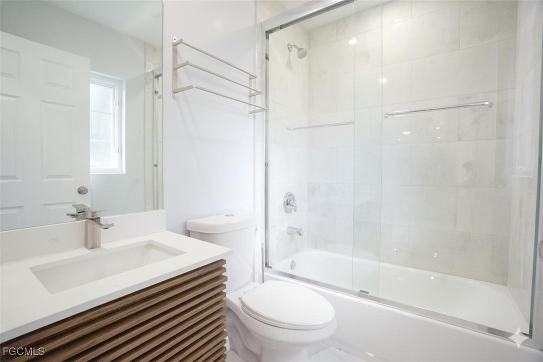 4970 Riverside Drive Estero, FL 33928 - Photo 20 of 35 a bathroom with a sink toilet and shower