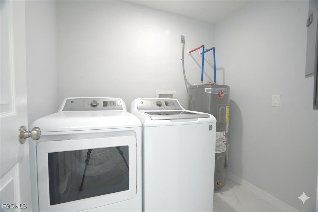 4970 Riverside Drive Estero, FL 33928 - Photo 24 of 35 a utility room with dryer and washer