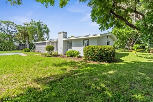 an aerial view of houses with yard