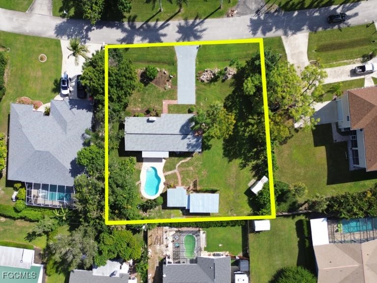 4970 Riverside Drive Estero, FL 33928 - Photo 26 of 35 an aerial view of houses with yard
