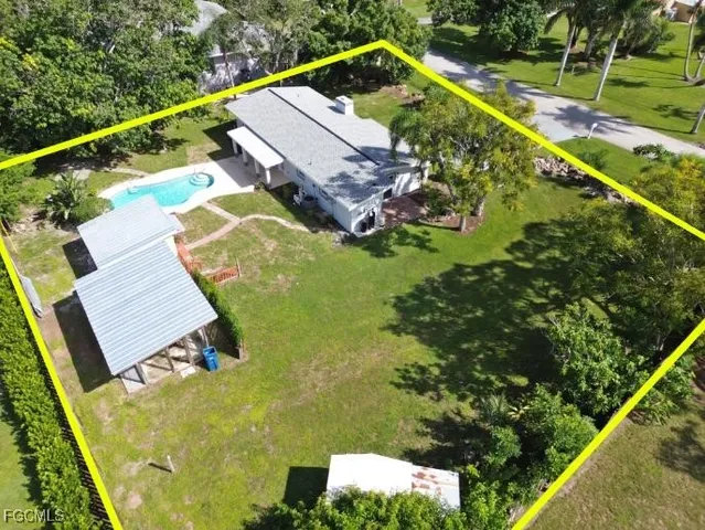 an aerial view of a house with a garden statue