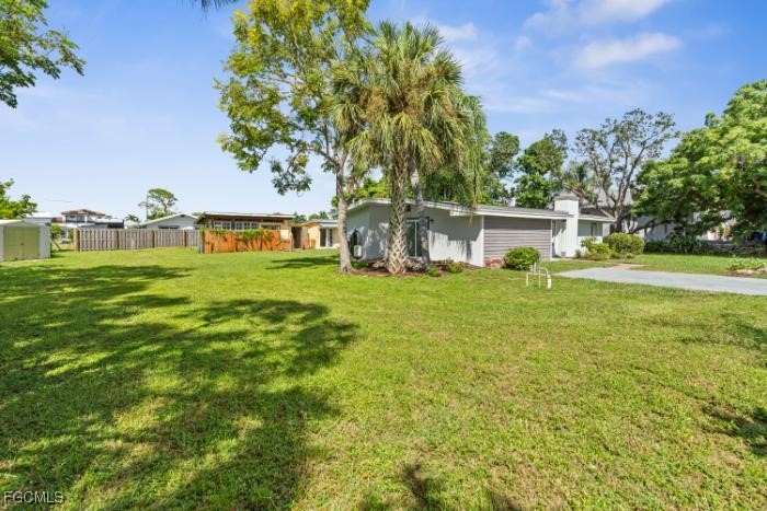 4970 Riverside Drive Estero, FL 33928 - Photo 3 of 35 a view of a house with a big yard