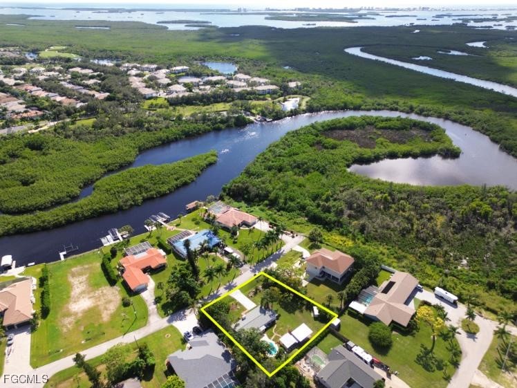 4970 Riverside Drive Estero, FL 33928 - Photo 31 of 35 an aerial view of residential houses with outdoor space