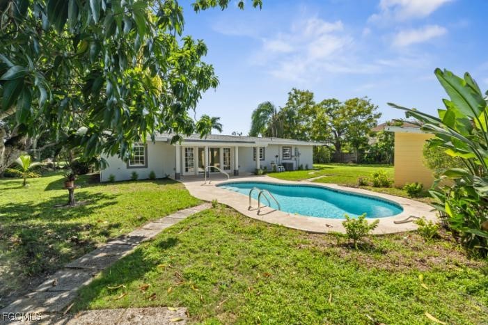 4970 Riverside Drive Estero, FL 33928 - Photo 4 of 35 a view of a house with a big yard