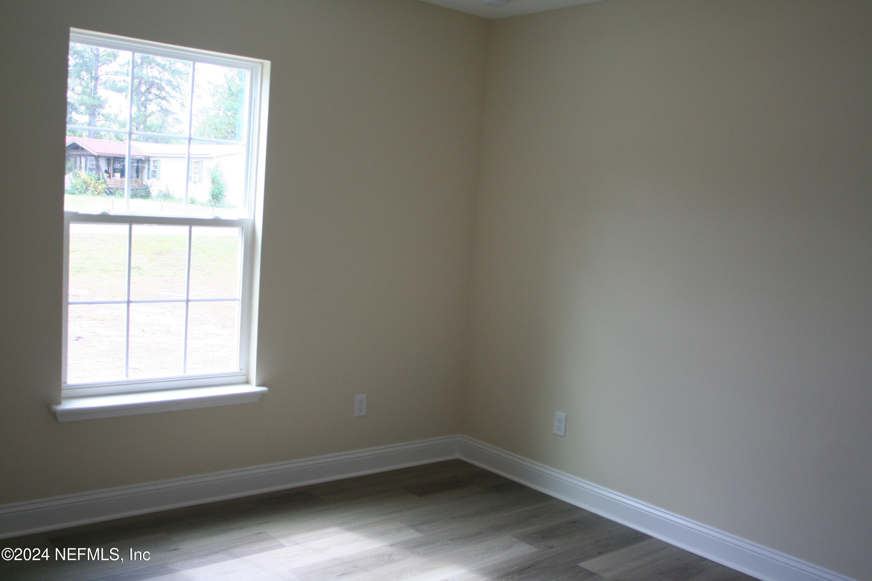 54835 Dornbush Road Callahan, FL 32011 - Photo 6 of 31 an empty room with a window