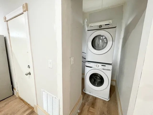 a utility room with sink dryer and washer