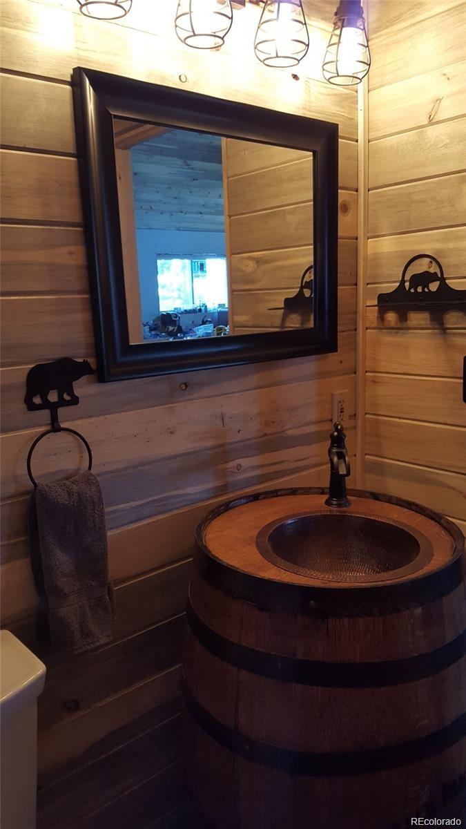 1 Sagamore Trail Black Hawk, CO 80422 - Photo 16 of 34 a bathroom with a sink and a mirror