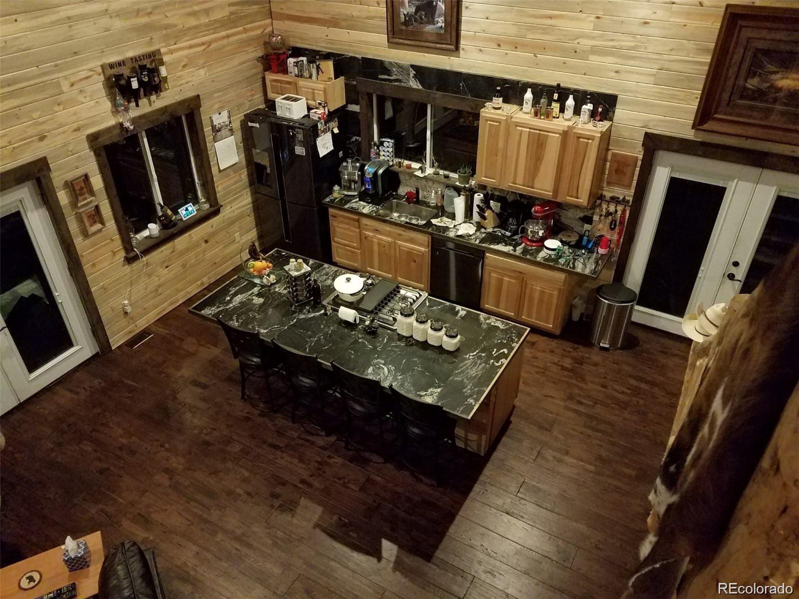 1 Sagamore Trail Black Hawk, CO 80422 - Photo 2 of 34 a living room with furniture and a fireplace