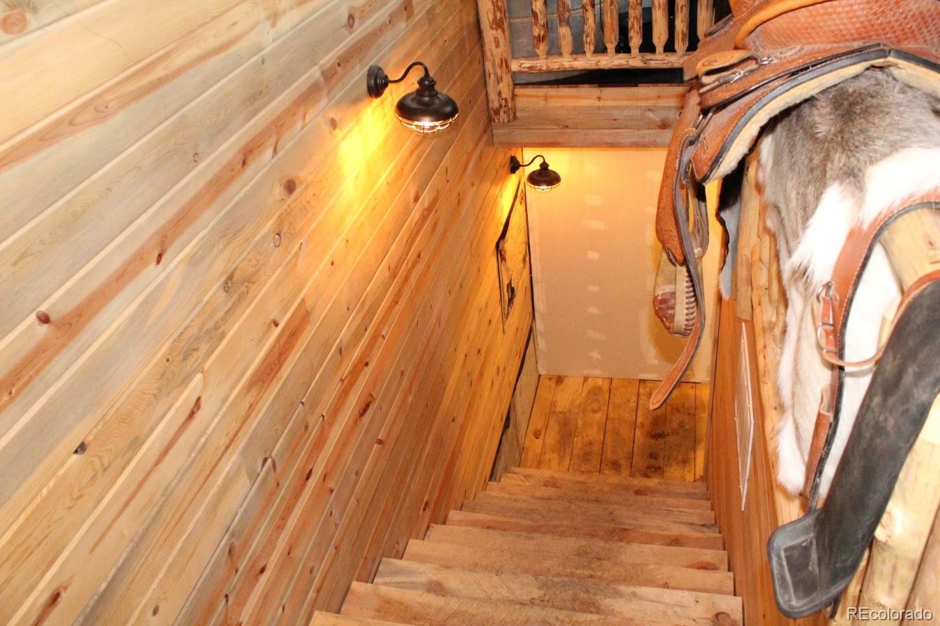 1 Sagamore Trail Black Hawk, CO 80422 - Photo 22 of 34 a view of a room with wooden floor and door