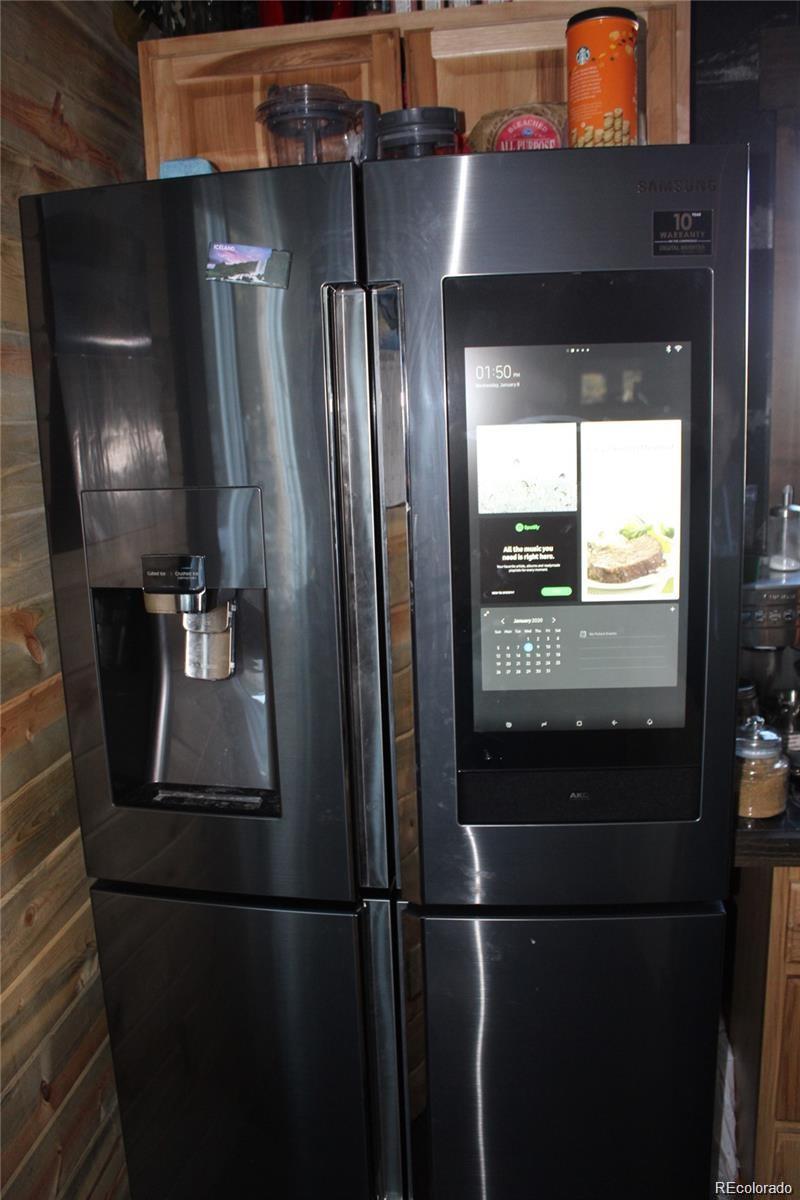 1 Sagamore Trail Black Hawk, CO 80422 - Photo 34 of 34 a kitchen with a refrigerator and wooden floor