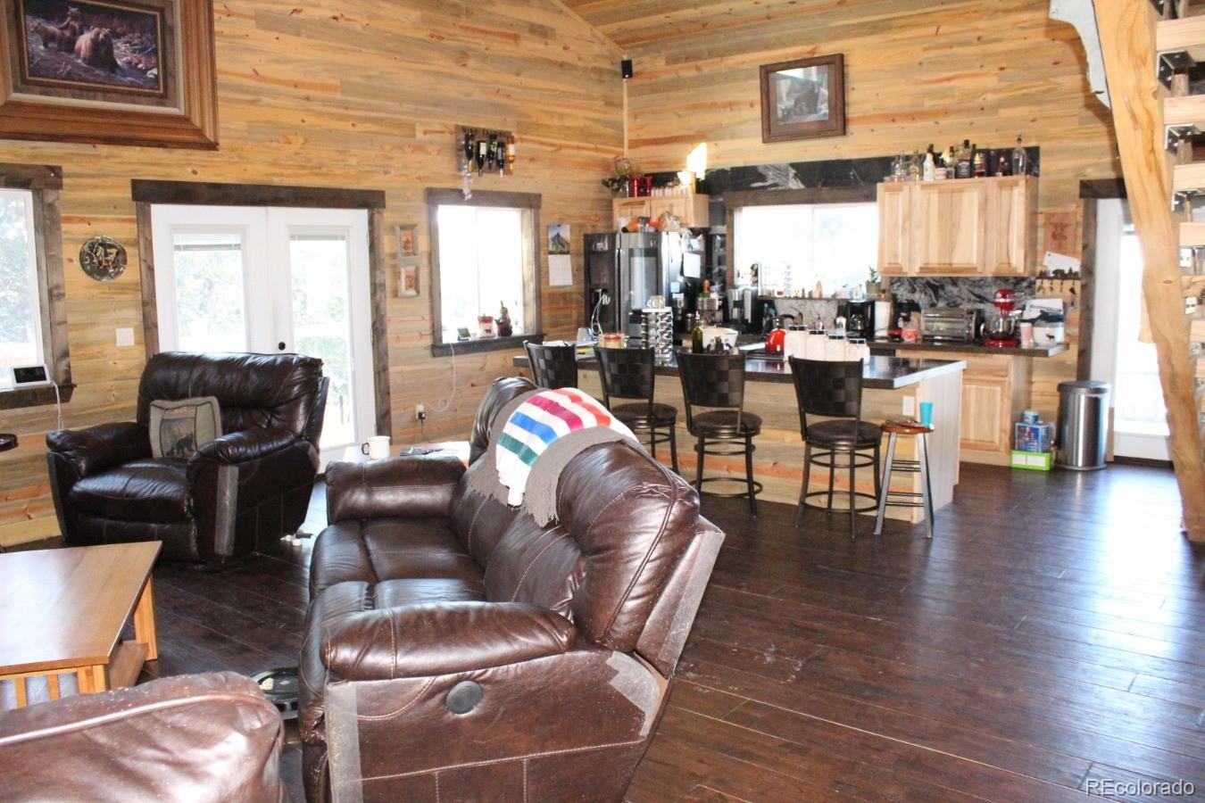 1 Sagamore Trail Black Hawk, CO 80422 - Photo 7 of 34 a living room filled with furniture and a floor to ceiling window