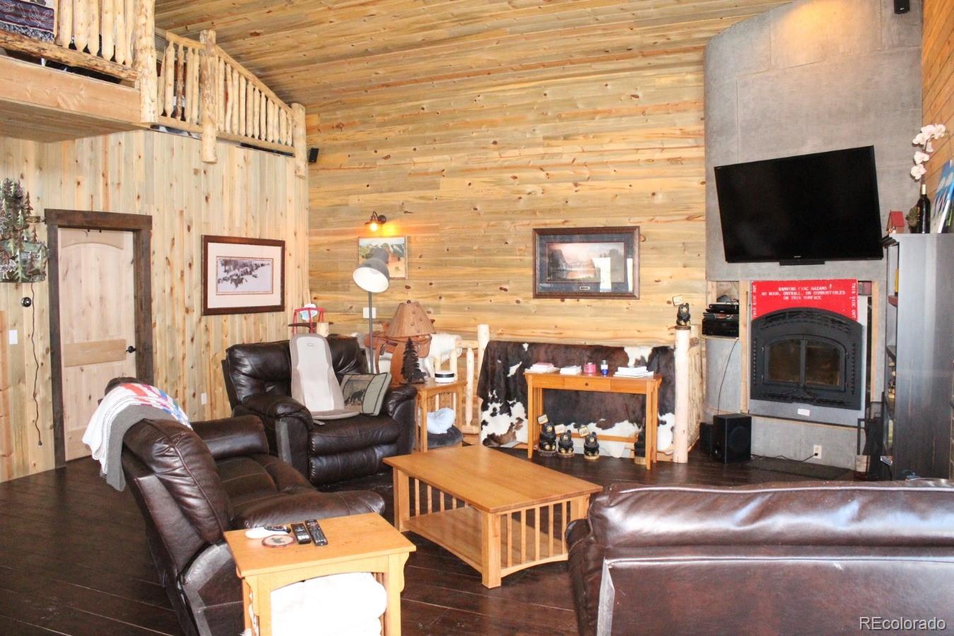 1 Sagamore Trail Black Hawk, CO 80422 - Photo 8 of 34 a living room with furniture and a flat screen tv