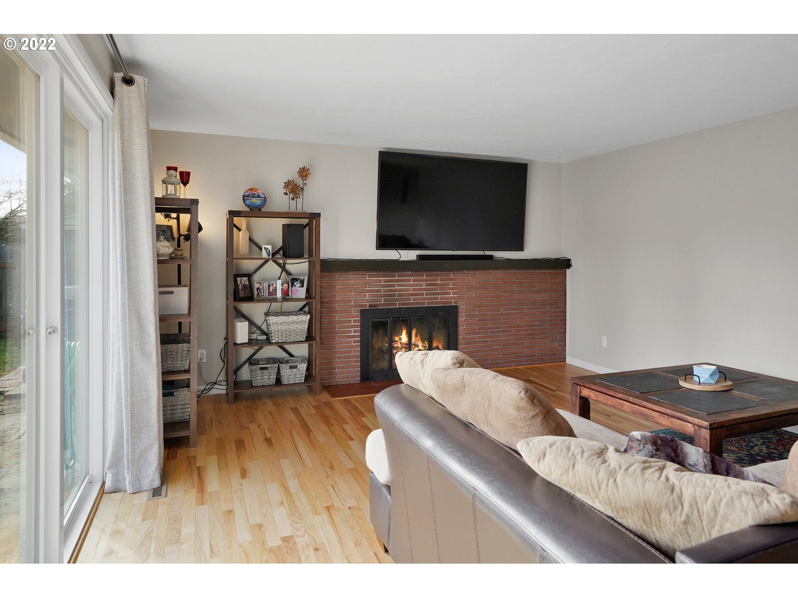 1771 Linwood Street Eugene, OR 97404 - Photo 12 of 22 a living room with furniture a flat screen tv and a fireplace