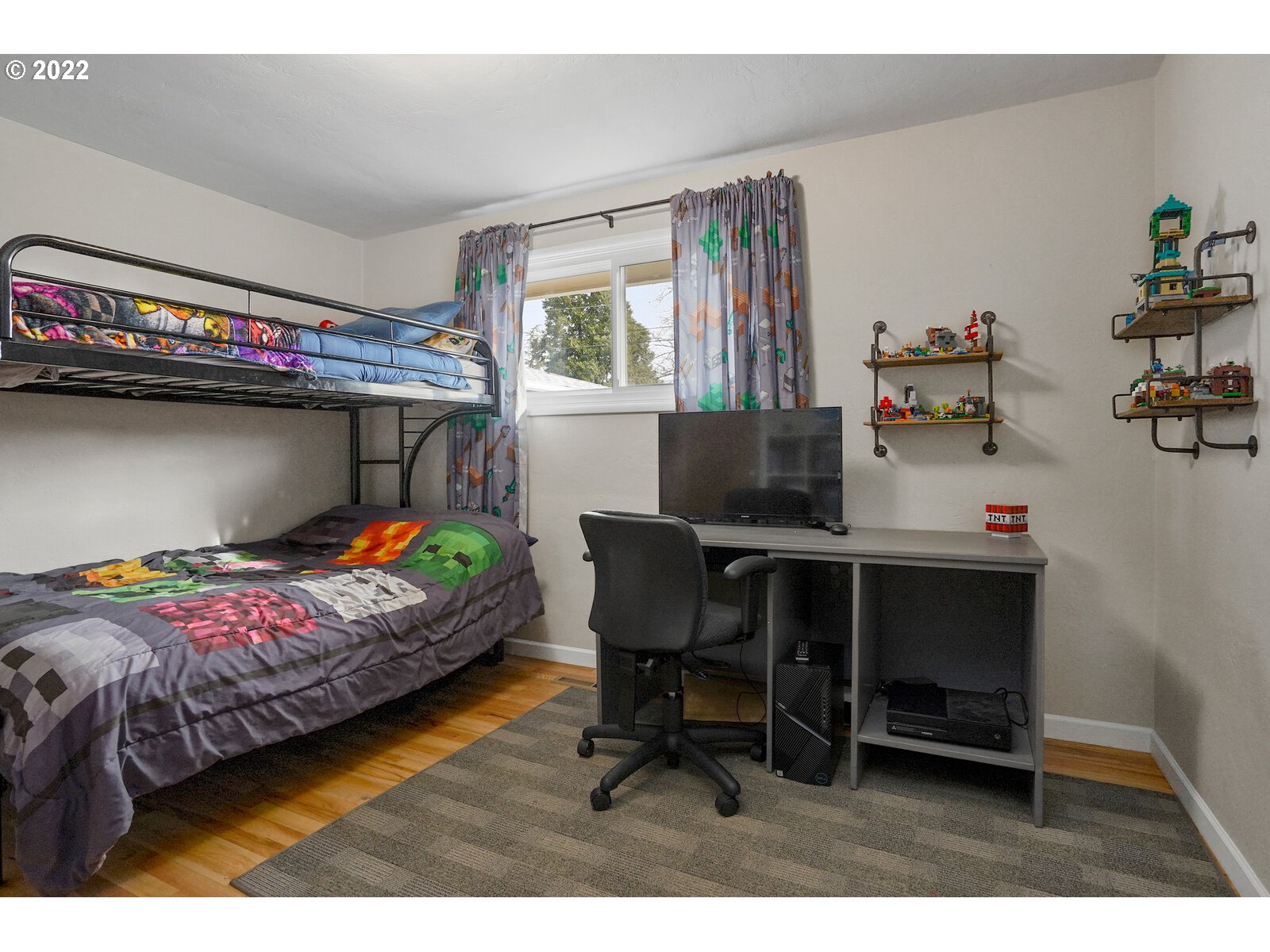1771 Linwood Street Eugene, OR 97404 - Photo 16 of 22 a bedroom with a bed and a table in it