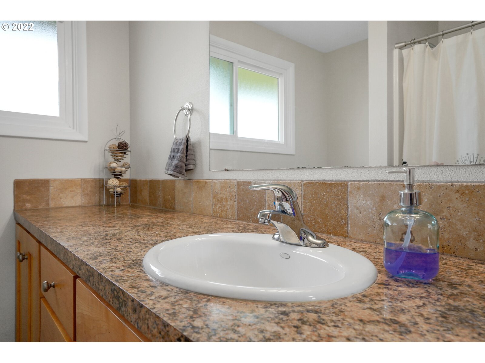 1771 Linwood Street Eugene, OR 97404 - Photo 18 of 22 a bathroom with a sink and a mirror