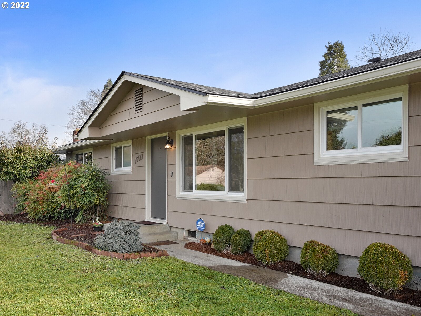 1771 Linwood Street Eugene, OR 97404 - Photo 2 of 22 a front view of a house with garden