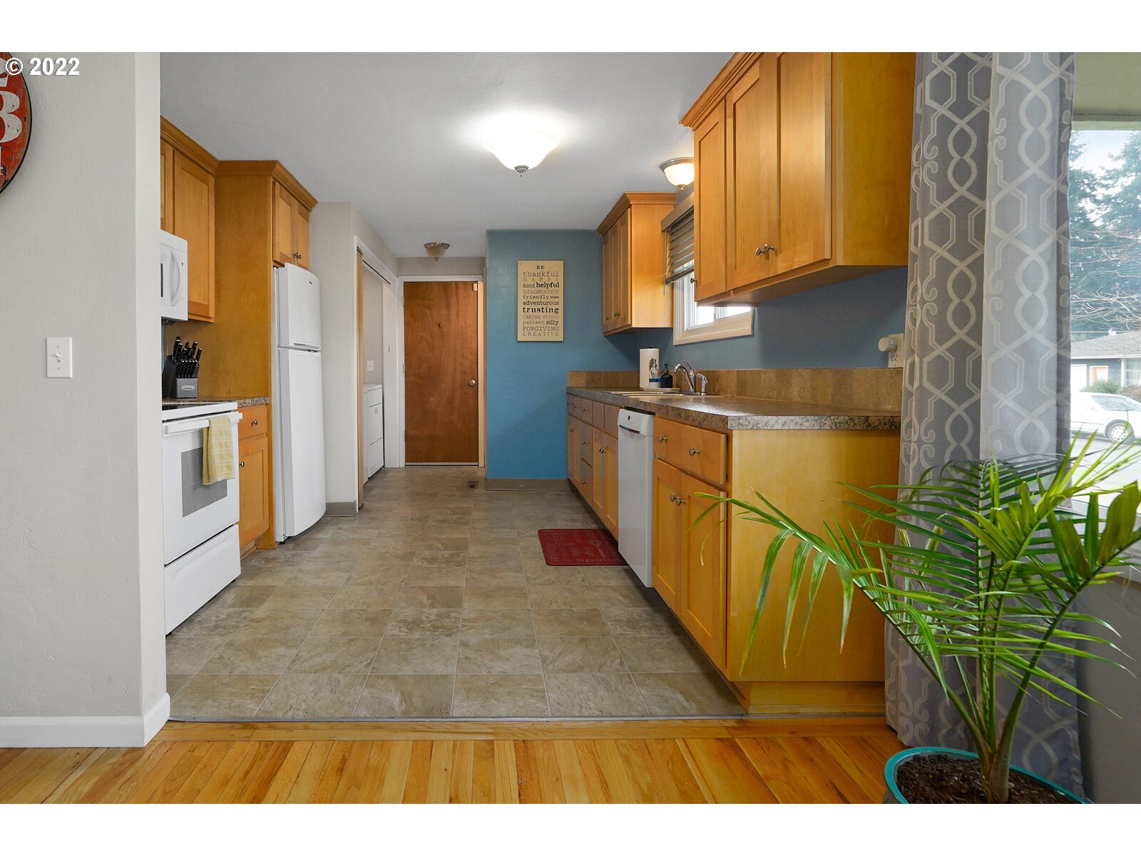 1771 Linwood Street Eugene, OR 97404 - Photo 4 of 22 a open kitchen with stainless steel appliances granite countertop a refrigerator a stove and a wooden cabinets