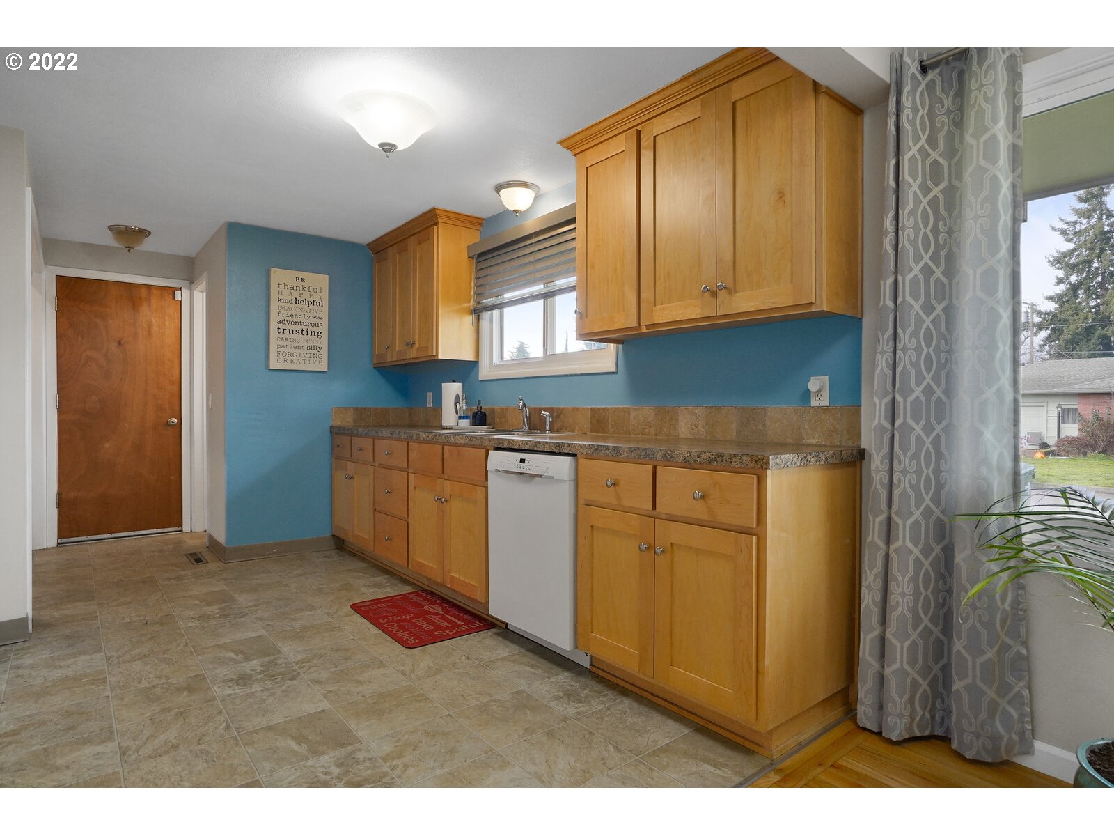 1771 Linwood Street Eugene, OR 97404 - Photo 5 of 22 a kitchen with cabinets a sink and a stove