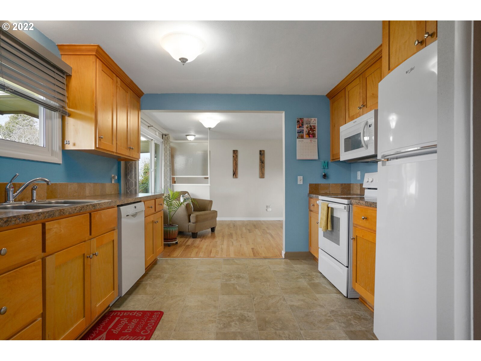 1771 Linwood Street Eugene, OR 97404 - Photo 9 of 22 a kitchen with stainless steel appliances kitchen island granite countertop a refrigerator and a sink