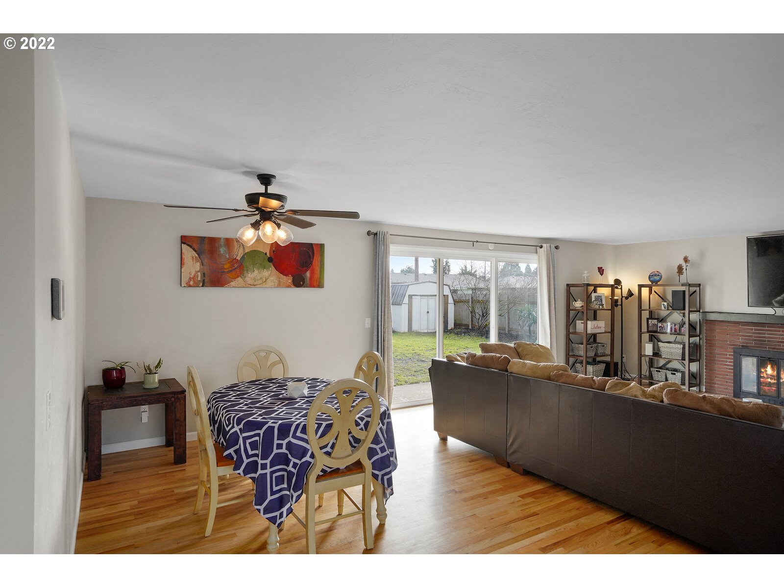 1771 Linwood Street Eugene, OR 97404 - Photo 10 of 22 a living room with furniture a chandelier and a dining table