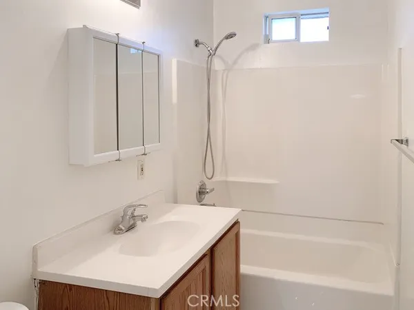 a bathroom with a sink and a bathtub