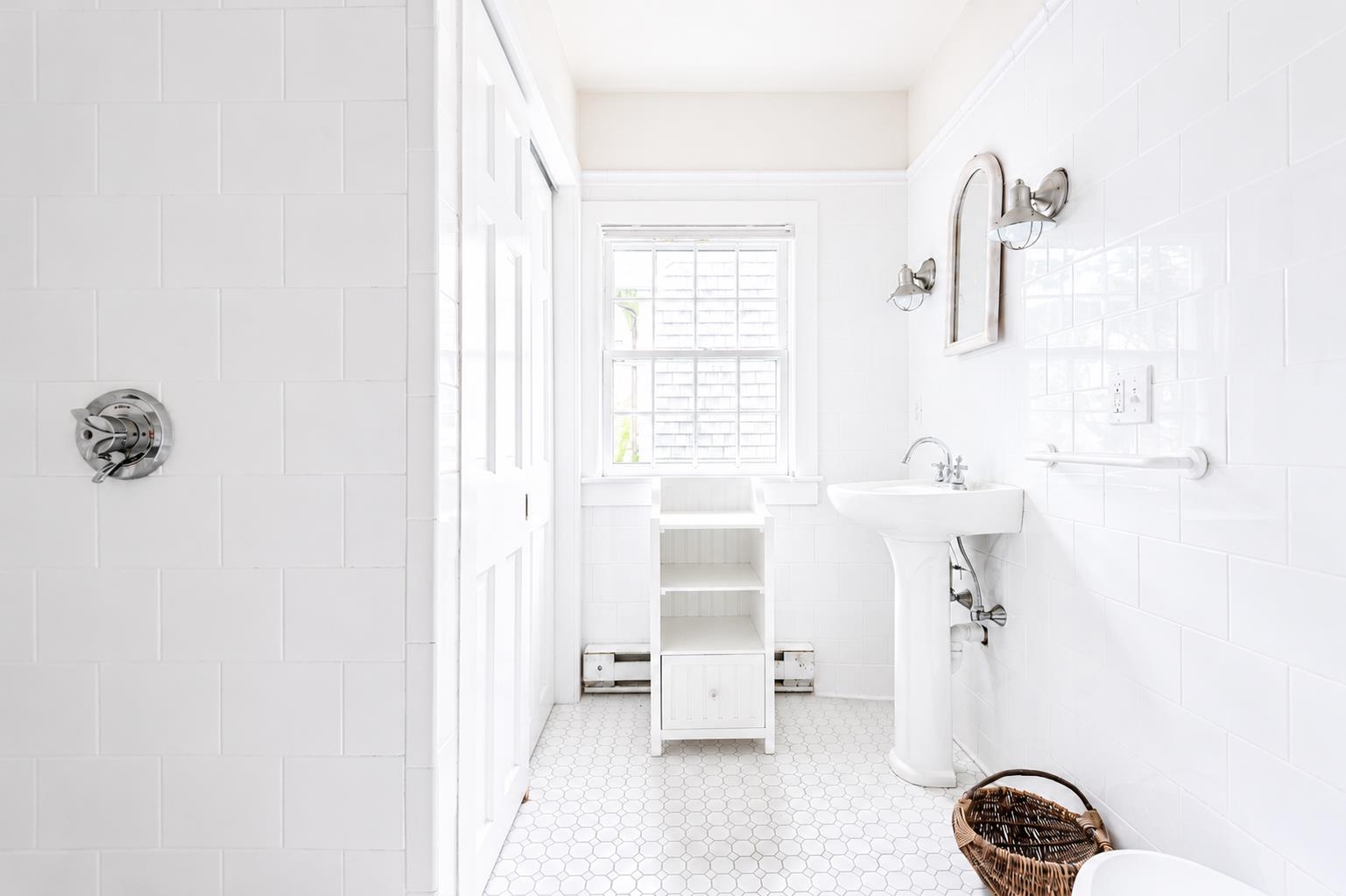 12 King Street Nantucket, MA 02554 - Photo 27 of 32 a bathroom with a bathtub and shower