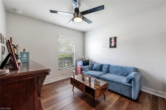 a living room with furniture and a window
