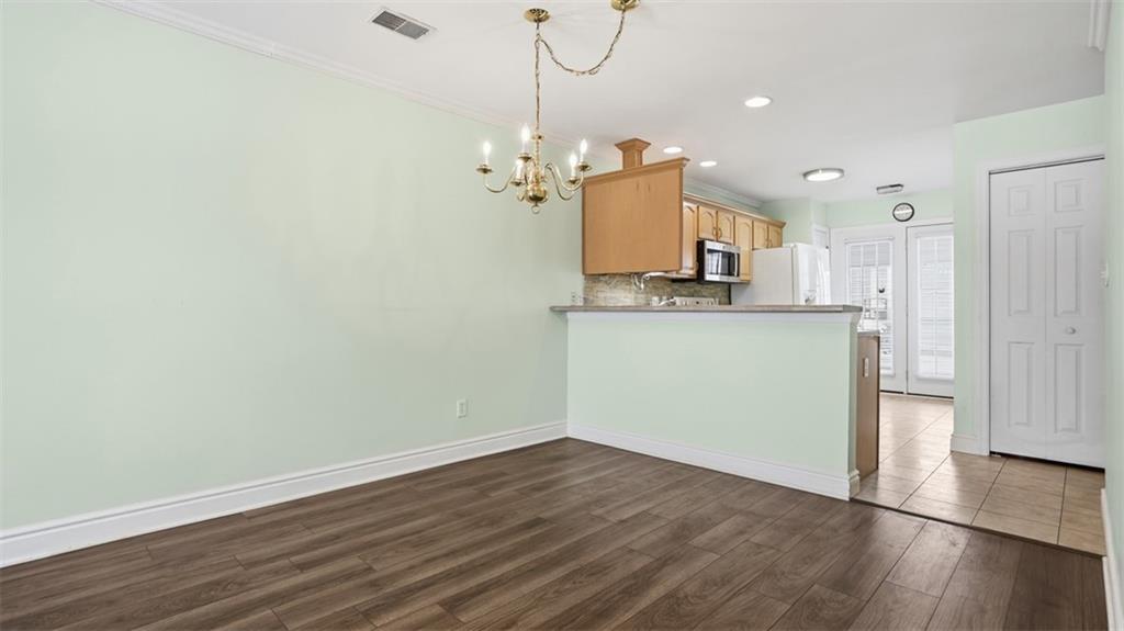 604 Elm Way Coraopolis, PA 15108 - Photo 11 of 30 a view of a kitchen with wooden floor and a refrigerator