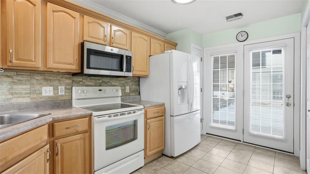 604 Elm Way Coraopolis, PA 15108 - Photo 13 of 30 a kitchen with cabinets stainless steel appliances and a counter space