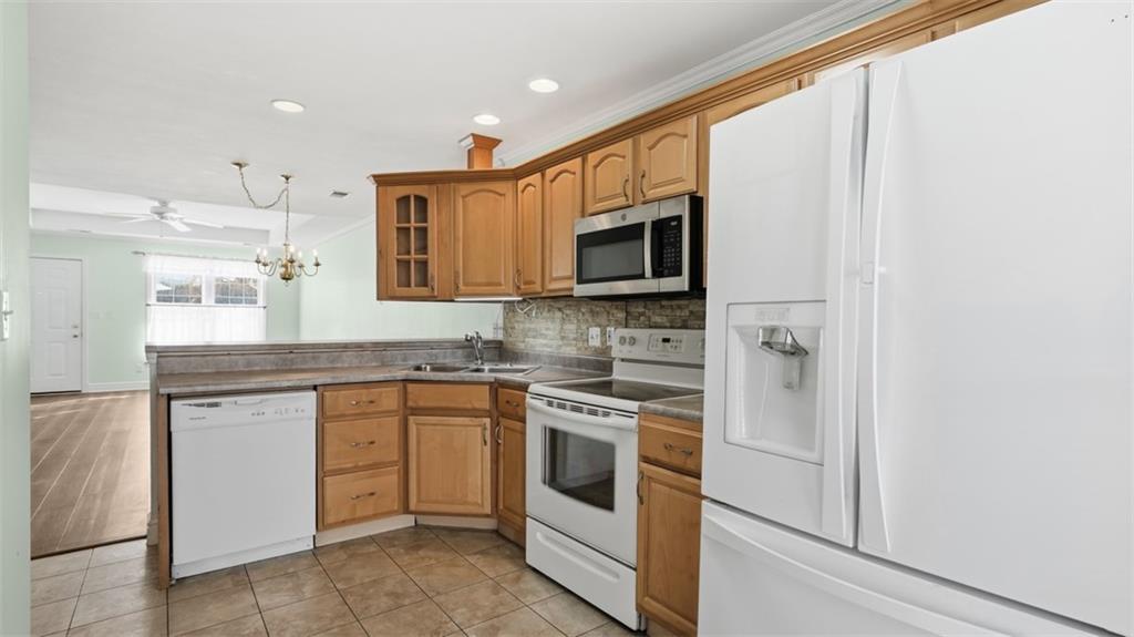 604 Elm Way Coraopolis, PA 15108 - Photo 15 of 30 a kitchen with stainless steel appliances granite countertop a stove and a microwave