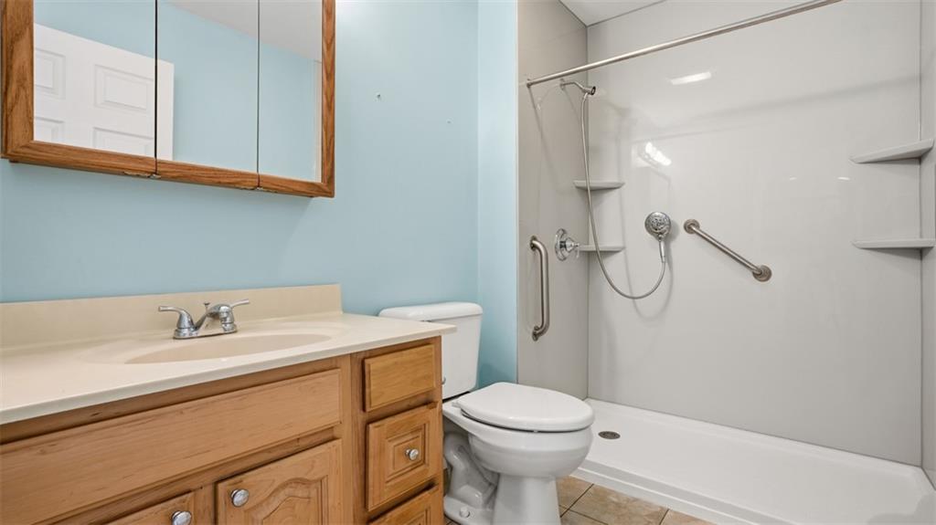 604 Elm Way Coraopolis, PA 15108 - Photo 27 of 30 a bathroom with a sink a toilet and shower