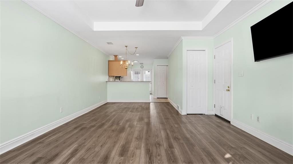 604 Elm Way Coraopolis, PA 15108 - Photo 7 of 30 a view of empty room with wooden floor and flat screen tv