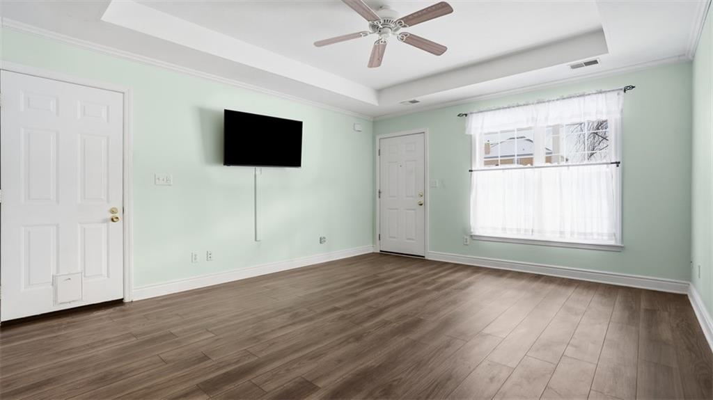 604 Elm Way Coraopolis, PA 15108 - Photo 9 of 30 a view of an empty room with wooden floor and a window