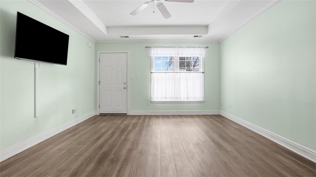 604 Elm Way Coraopolis, PA 15108 - Photo 10 of 30 an empty room with wooden floor and windows
