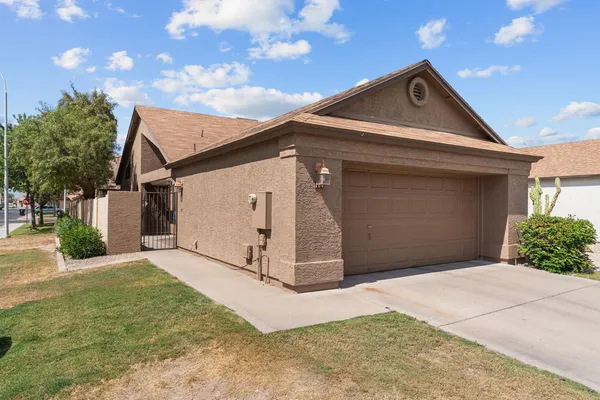 a front view of a house with a garage