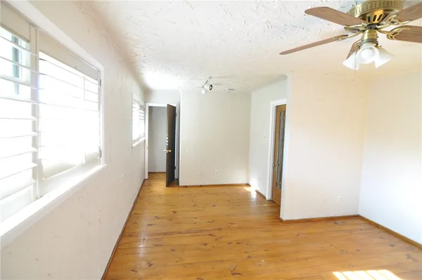 a view of a hallway with a window