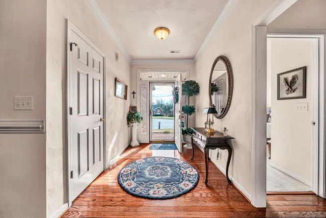 a view of a livingroom with furniture and entryway